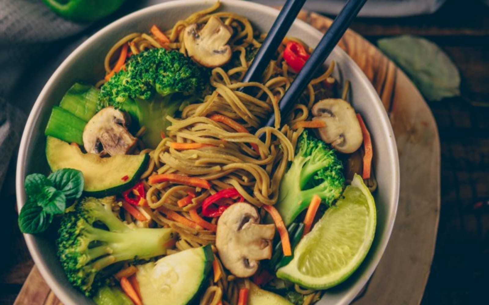 Vegan Quick High-Protein Vegetable Stir-Fry with lime, noodles, and vegetables
