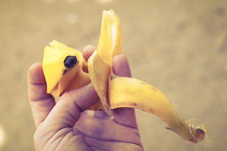 someone holding a banana peel