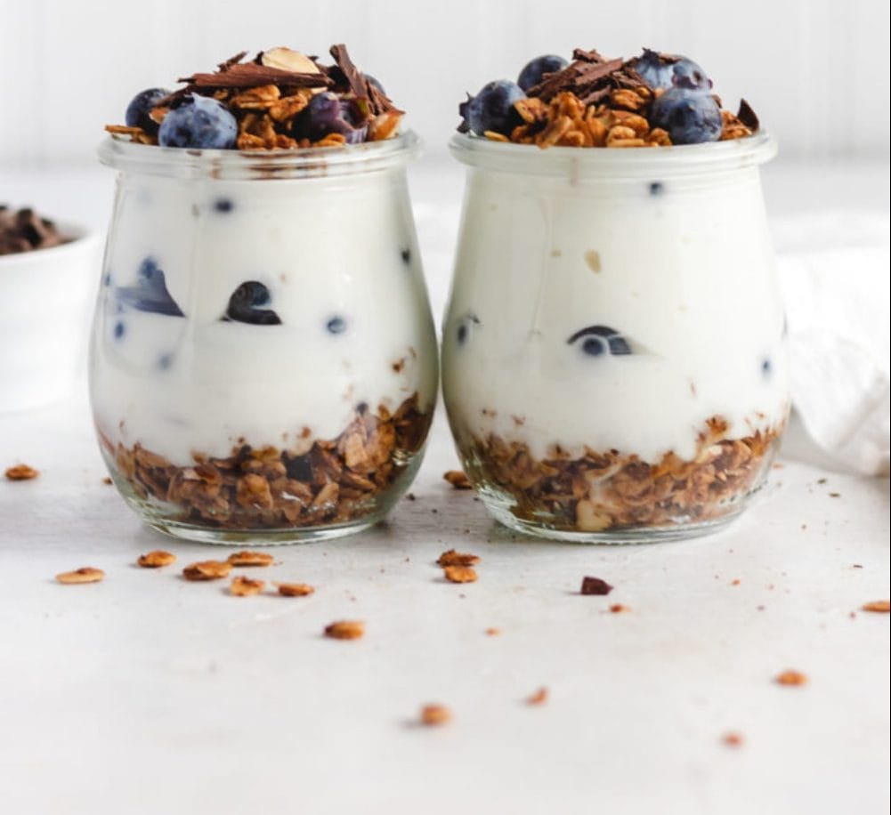 Almond Butter Vanilla bean granola parfait with cacao nibs and blueberries