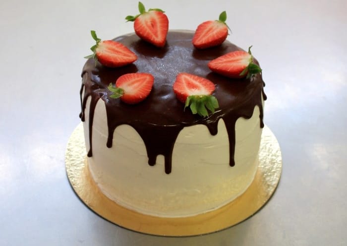 vegan White Chocolate Mousse Cake With Chocolate Drizzle and Strawberries