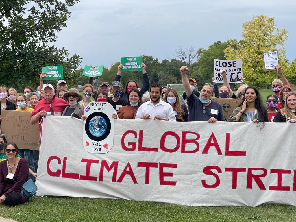 Global climate strike protestors holding sign
