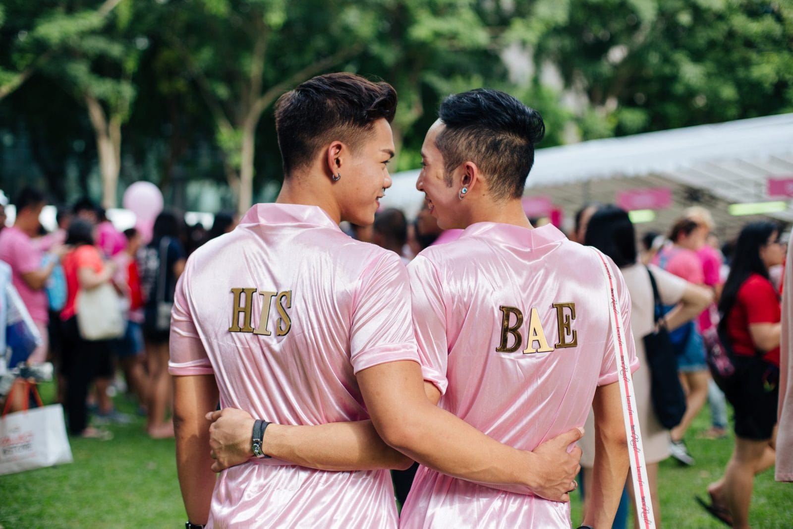 Two men holding each other in Singapore
