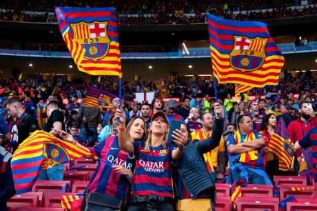 FC barcelona fans cheering at a game