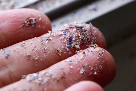 Close up shot of microplastics on someone's hand